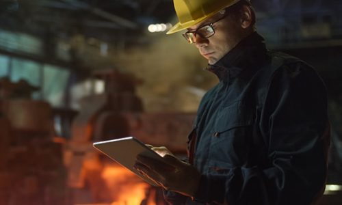 Engineer in Glasses using Tablet PC in Foundry. Industrial Environment. Engineer in Glasses using Tablet PC in Foundry. Industrial Environment.