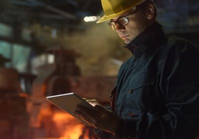 Engineer in Glasses using Tablet PC in Foundry. Industrial Environment. Engineer in Glasses using Tablet PC in Foundry. Industrial Environment.